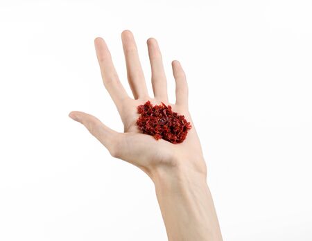 Hookah topic: Bartender holding a clay bowl with tobacco for hookah isolated on white backgroundの写真素材