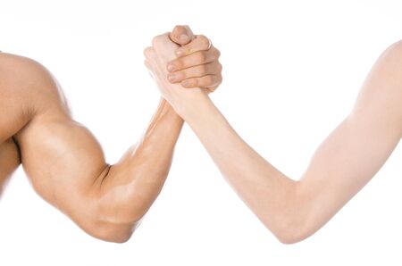Bodybuilding & Fitness Topic: arm wrestling thin hand and a big strong arm isolated on white backgroundの写真素材