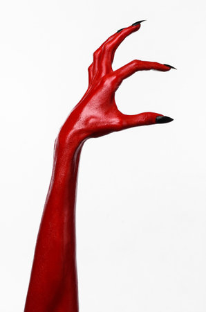 Red Devil's hands, red hands of Satan, Halloween theme, white background, isolated