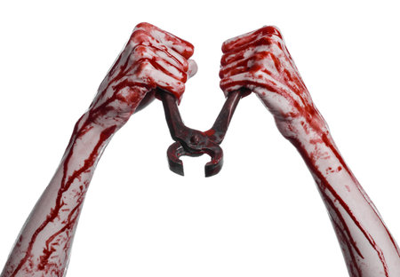 Halloween theme: bloody hand holding a pliers on a white background studio