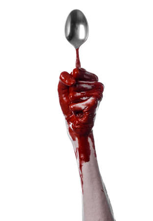 bloody hand holding a spoon, fork, halloween theme, bloody spoon, fork, white background, isolated studioの写真素材