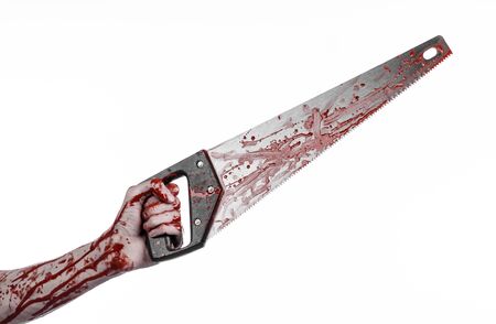 Halloween theme: bloody hand holding a bloody saw on a white backgroundの写真素材