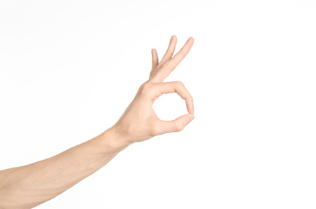 Hand gestures theme: the human hand shows gestures isolated on white backgroundの写真素材
