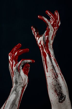 Bloody Halloween theme: horrible zombie demon bloody hands on a black backgroundの写真素材