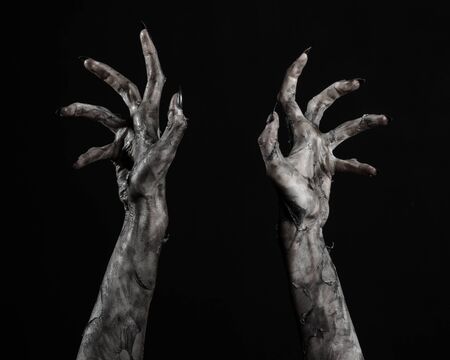 black hand of death, the walking dead, zombie theme, halloween theme, zombie hands, black background, isolated, hand of death, mummy hands, the hands of the devil, black nails, hands monsterの写真素材