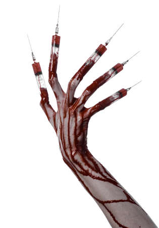 Bloody hand with syringe on the fingers, toes syringes, hand syringes, horrible bloody hand, halloween theme, zombie doctor, white background, isolatedの写真素材