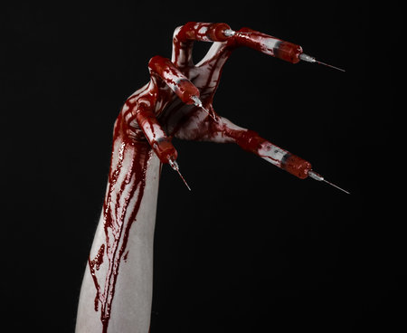 Bloody hand with syringe on the fingers, toes syringes, hand syringes, horrible bloody hand,...