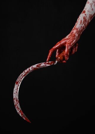 bloody hand holding a sickle, sickle bloody, bloody scythe, bloody theme, halloween theme, black background, isolated, killer, psycho, thug, a bloody knife, bloody hands of zombies, cutthroatの写真素材