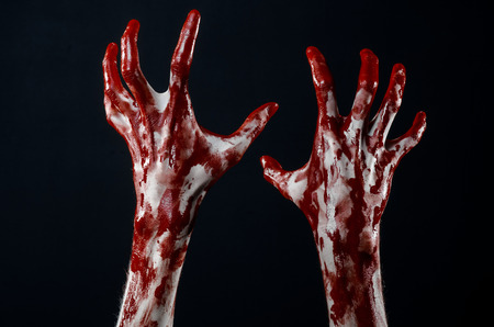 Bloody hands in white gloves, a scalpel, a nail, black background, zombie, demon, maniacの写真素材