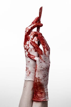 Bloody hands in gloves with the scalpel, white background, isolated, doctor, killer, maniac studioの写真素材