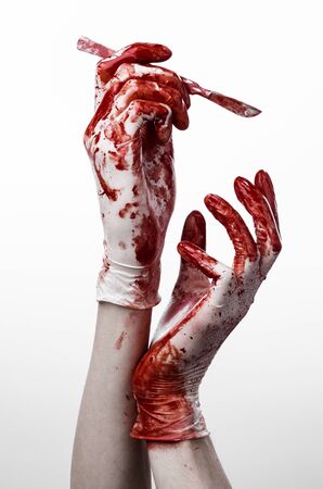 Bloody hands in gloves with the scalpel, white background, isolated, doctor, killer, maniac studioの写真素材