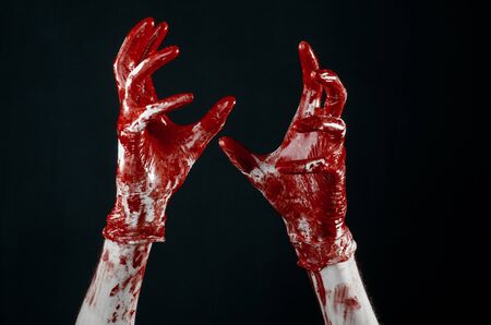 Bloody hands in white gloves, a scalpel, a nail, black background, zombie, demon, maniacの写真素材