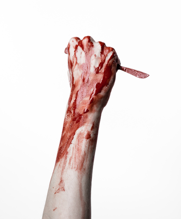Bloody hand with a scalpel, a nail, white background, zombie, demon, maniacの写真素材