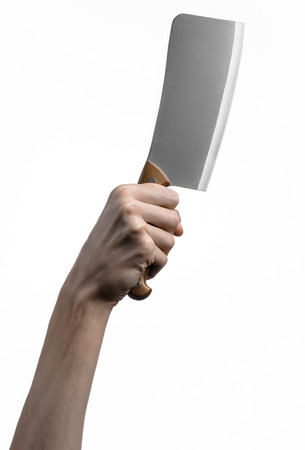 Hand holding a knife for meat, cleaver, chef holding a knife, a large knife, kitchen knife, kitchen theme, white background, isolated, butcher knifeの写真素材