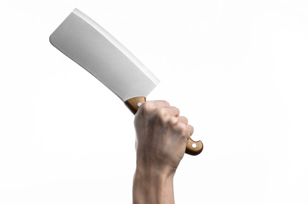 Hand holding a knife for meat, cleaver, chef holding a knife, a large knife, kitchen knife, kitchen theme, white background, isolated, butcher knifeの写真素材