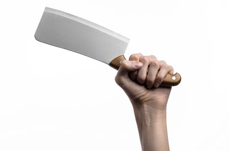 Hand holding a knife for meat, cleaver, chef holding a knife, a large knife, kitchen knife, kitchen theme, white background, isolated, butcher knifeの写真素材