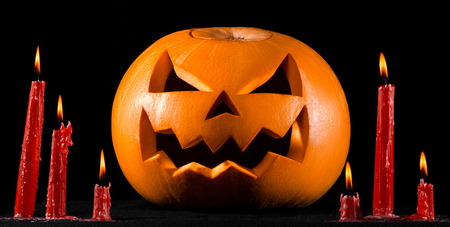 Scary pumpkin, jack lantern, pumpkin halloween, red candles on a black background, halloween theme, pumpkin killerの写真素材