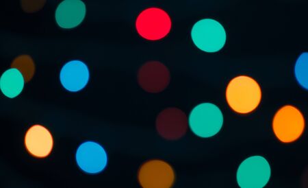 Abstract blurred background and theme: colorful bokeh blurred lights on a darkの写真素材