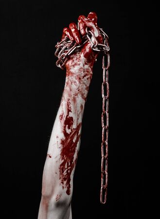 bloody hand holding chain, bloody chain, halloween theme, black background, isolated, killer, fan, crazyの写真素材