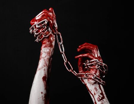 bloody hand holding chain, bloody chain, halloween theme, black background, isolated, killer, fan, crazyの写真素材