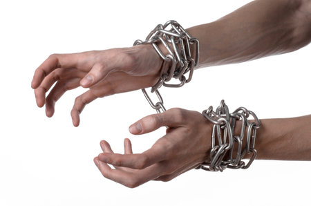Social theme: hands tied a metal chain on a white background