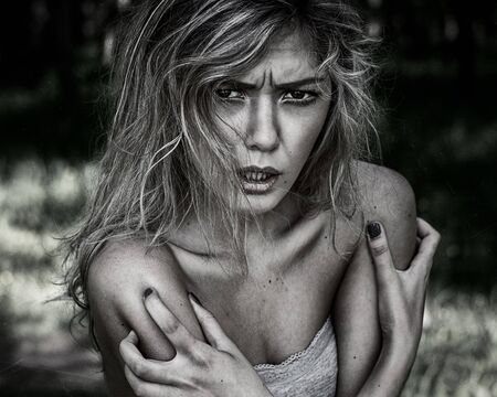 Nightmare and Halloween theme: portrait of scary girl witchの写真素材