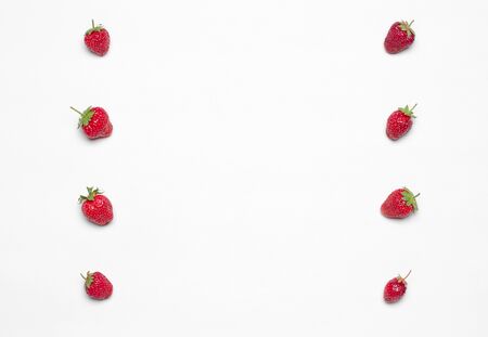 Healthy eating in the restaurant and diet Topic: Beautiful ripe strawberry lie in a frame on a white table in the studio isolated top view studioの写真素材
