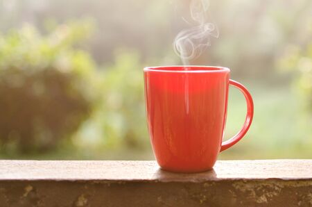 Coffee mug with smoke in natural outdoorの写真素材