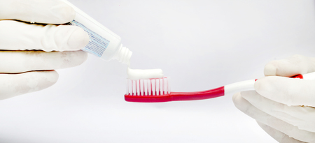 Tooth brushing tecnique with toothpaste isolated in white backgroundの写真素材