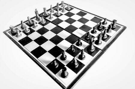 Black and white chessboard top view isolated in white backgroundの写真素材
