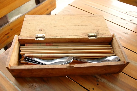 Spoons and Chopsticks in wood boxの写真素材