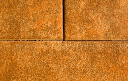 photo of floor tile textured and colored like a bricks