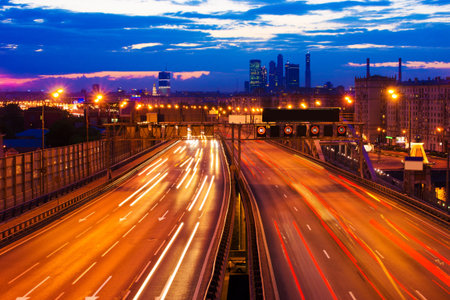 moscow night city landscape with traffic lights at the road  highway  in dusk at sunset  sunrise 