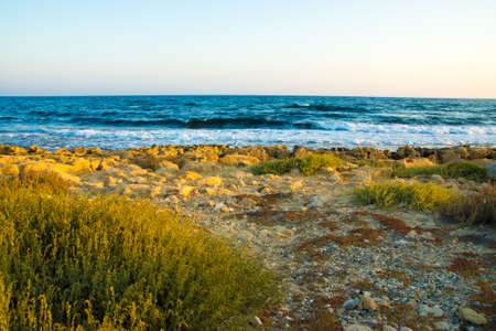 mediterranean landscape coast sea waves at sunsetの写真素材