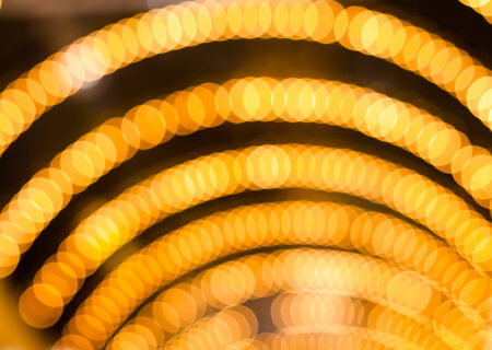 Defocused abstract yellow gold lights christmas arch backgroundの写真素材