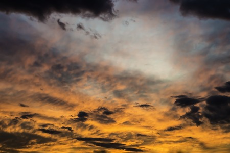 colorful dramatic sky with cloud at sunsetの写真素材