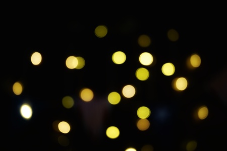 Fireworks display celebrates the independence Day of the United States of America nation on the fourth of July with the us flag , sparklers , candy, on the red background and on the background of Christmas garland and bokeh, with the stars , the end of the Celebration of freedom.の写真素材