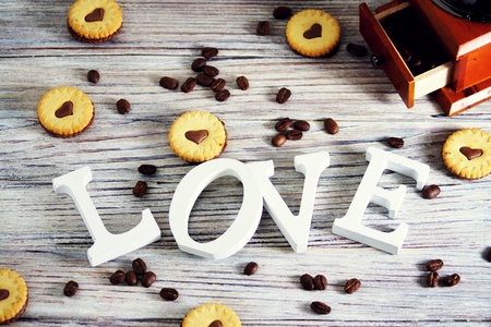 cookies in the shape of hearts, on the cookie letters LOVE. the concept of a gift for Valentine's day on February 14. selective focus.の写真素材