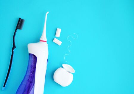 Oral hygiene, dental hygiene using dental tools, dental floss, irrigator, brush, chewing gum. The concept of healthの写真素材
