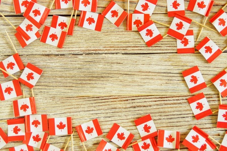 National day of Canada concept with flag on white wooden background top view.の写真素材
