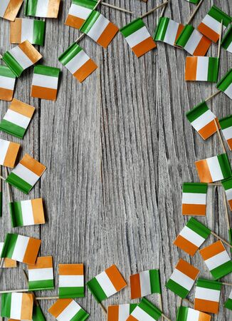 MARCH 17 Concept independence day of Ireland and Ireland national day.space for your text . mini flags on white wooden background. verticalの写真素材