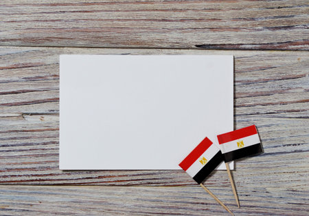 Egypt hanging flag for honour of veterans day or memorial day on light blue dark velvet background....