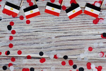 Egypt hanging flag for honour of veterans day or memorial day on light blue dark velvet background. Egypt glory to the heroes of war concept.の写真素材