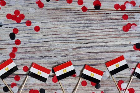 Egypt hanging flag for honour of veterans day or memorial day on light blue dark velvet background. Egypt glory to the heroes of war concept.の写真素材