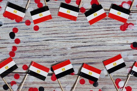 Egypt hanging flag for honour of veterans day or memorial day on light blue dark velvet background. Egypt glory to the heroes of war concept.の写真素材