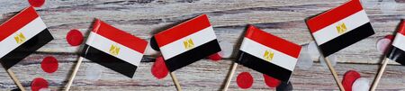 Egypt hanging flag for honour of veterans day or memorial day on light blue dark velvet background. Egypt glory to the heroes of war concept.の写真素材