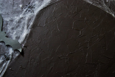 Cobweb or spider's web against a black background, to be used as overlay for Halloween designs.