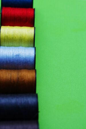 threads and needles on the background with patterns, accessories for cutting and sewing, womens hobby, tailoringの写真素材