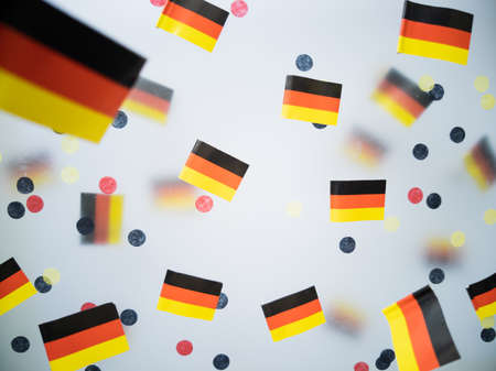 German Unity Day. October 3. National flags on a foggy background. The concept of patriotism, memory, and freedomの写真素材