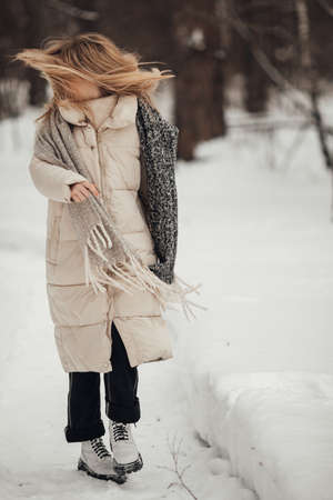 girl having fun in the winter forestの写真素材